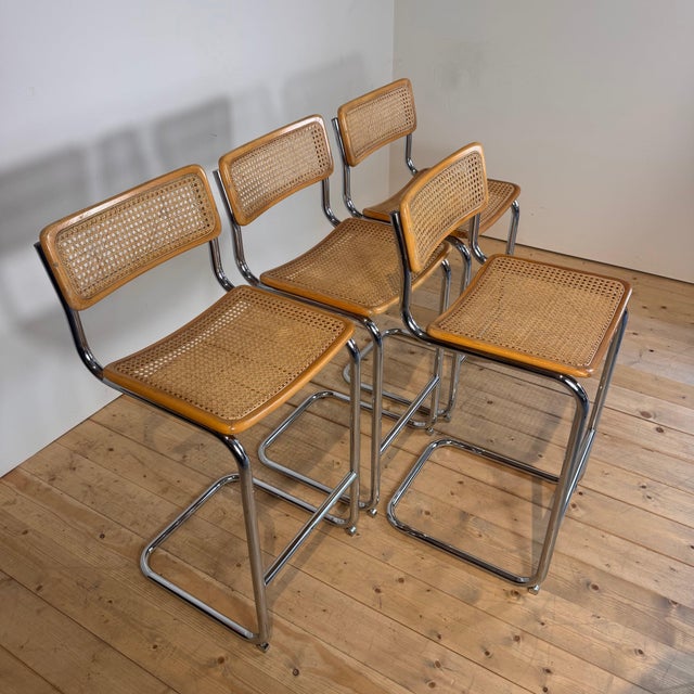 Set of four Italian wooden, Vienna straw, and chrome-plated steel stools, 1980s
