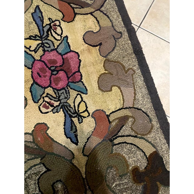 A charming and characterful antique American hand-hooked rug, made circa early 1900s — a direct expression of the great...
