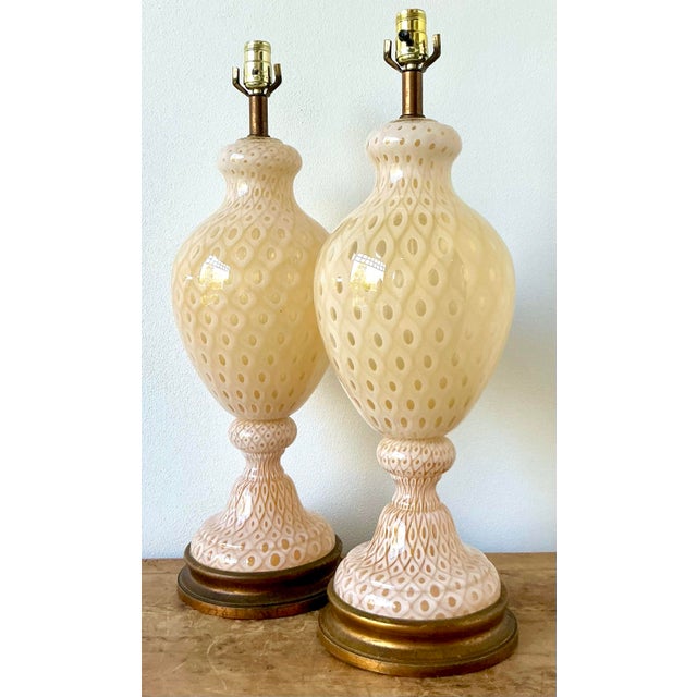 This exquisite pair of vintage Murano glass table lamps is a masterful display of mid-century Italian glassmaking. Each...