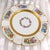 This is a lot of six white floral Rosenthal Dinner plate from Gimbles of New York. It has a gold encrusted band at the...