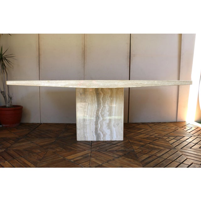 Exceptional Italian Postmodern dining table by Stone International, crafted entirely from beautiful beige travertine...
