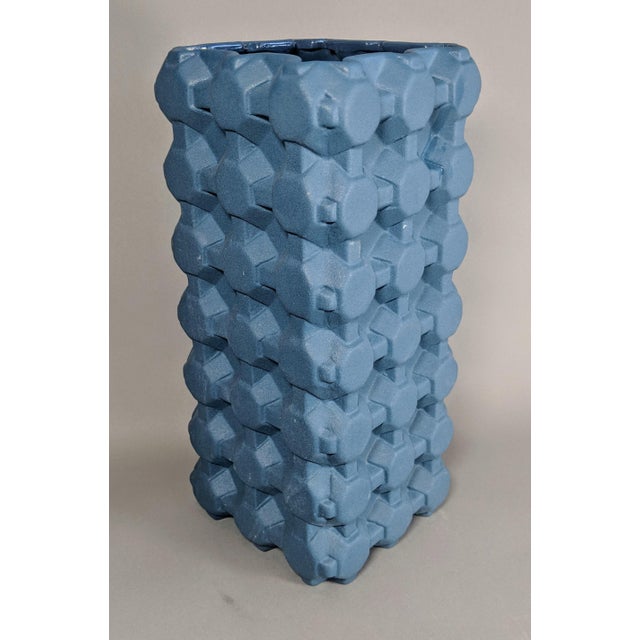 This geometric, gird vase from Thom Dixon is inspired from the looks of everyday patterns such as egg cartons. A perfect...