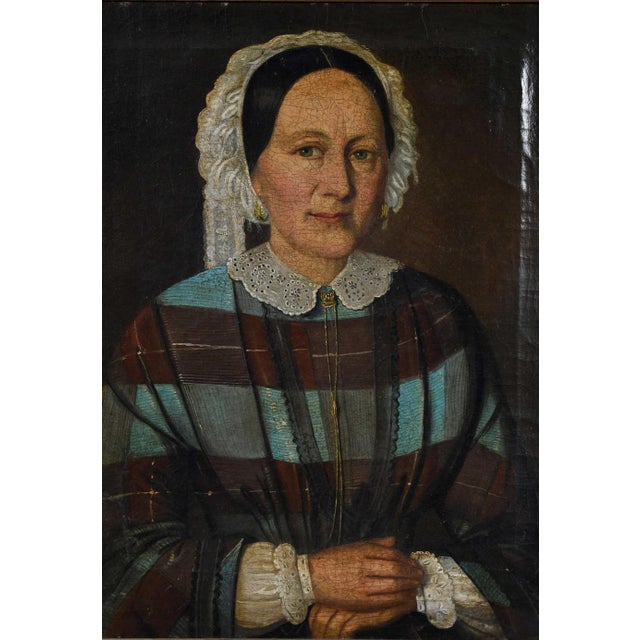 (American, 19th century) Lady in a Plaid Dress, unsigned, oil on canvas, 18 x 14-1/4 in.; dark wood frame, 21-1/2 x 18 in.