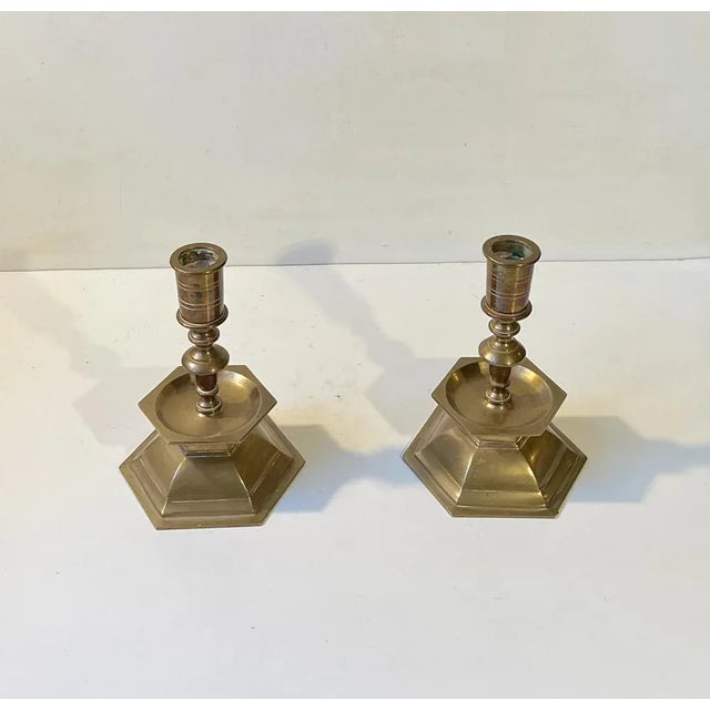 A pair of heavy altar candlesticks in brass. These came out of a Church Near Ribe in the western part of Denmark. The...