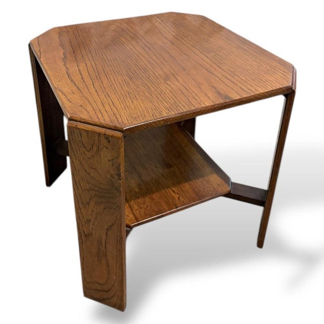 A beautifully proportioned Arts & Crafts oak occasional side table, showcasing honest craftsmanship, strong architectural...