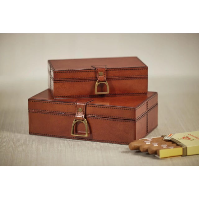 A beautiful decorative box made of leather with bold stitching that would render sophisticated look to your home...