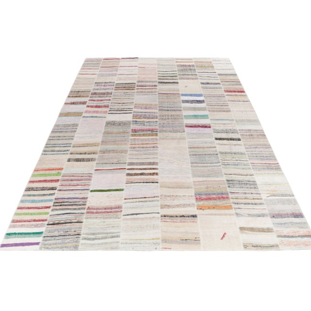 Rug & Kilim takes pride in presenting its artistic vision of patchwork kilim that reimagines vintage yarns into unique...