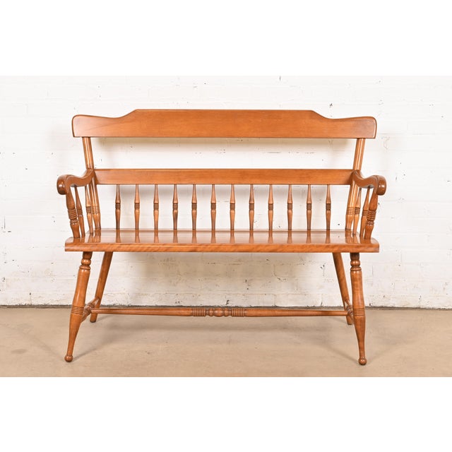 An exceptional American Colonial style carved solid maple spindle bench By Ethan Allen USA, Circa 1970s Measures: 48"W x...