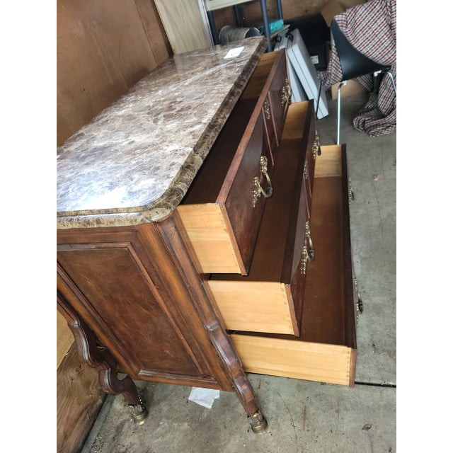 Beautiful piece from the Henredon Arabesque Collection. Marble Top with brass hardware.