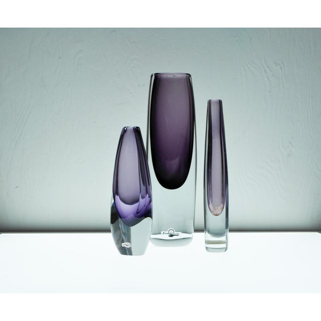 A striking trio of vintage Swedish Sommerso art glass vases, handblown and signed by renowned designers Gunnar Nylund and...