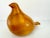 This mid-century modern bird sculpture is crafted from a warm, honey-toned wood, showcasing its natural grain and smooth...