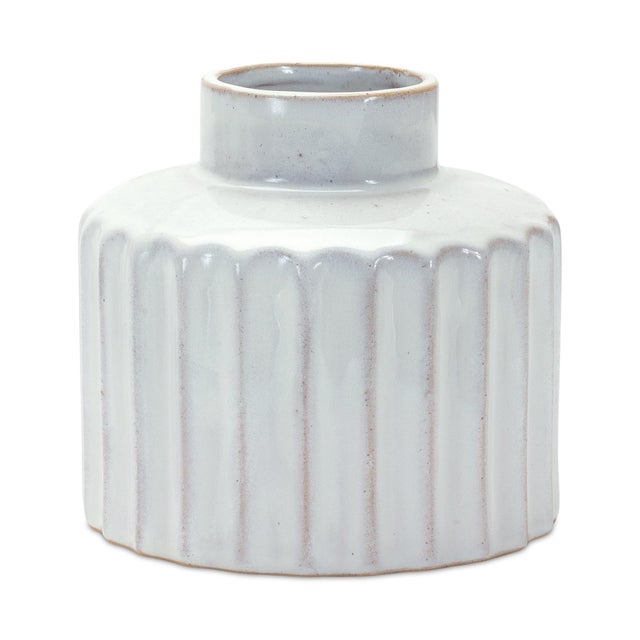 Add timeless elegance to your home with this Set of Ribbed Porcelain Vases. Featuring a washed white finish and textured...