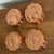 Set of four copper jello molds, each with a different fruit: pear, cherries, grapes and strawberries. Complete with...