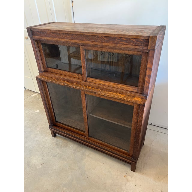 Bring timeless character and classic charm into your home with this antique Danner 2-Stack Bookcase. Featuring a...