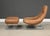 A mid century modern leather Earth Chair and ottoman with chrome sled bases designed by Percival Lafer. Made in Brazil....