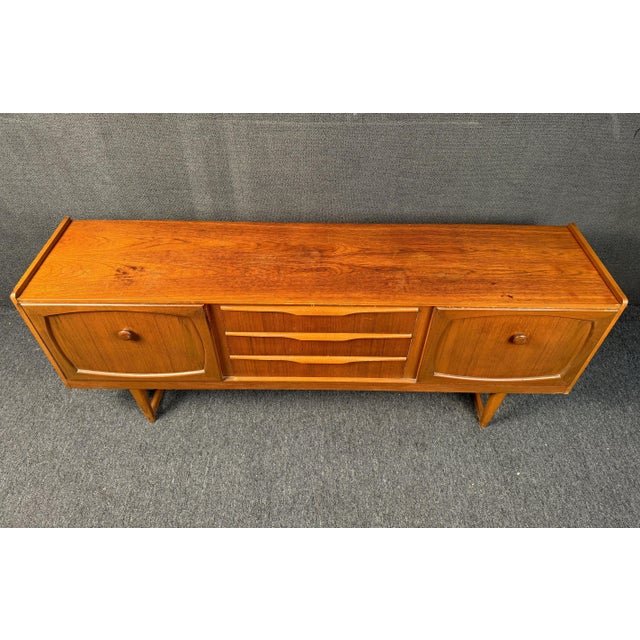 With post-war British craftsmanship and Scandinavian modern design influence, this beautiful English teak sideboard truly...