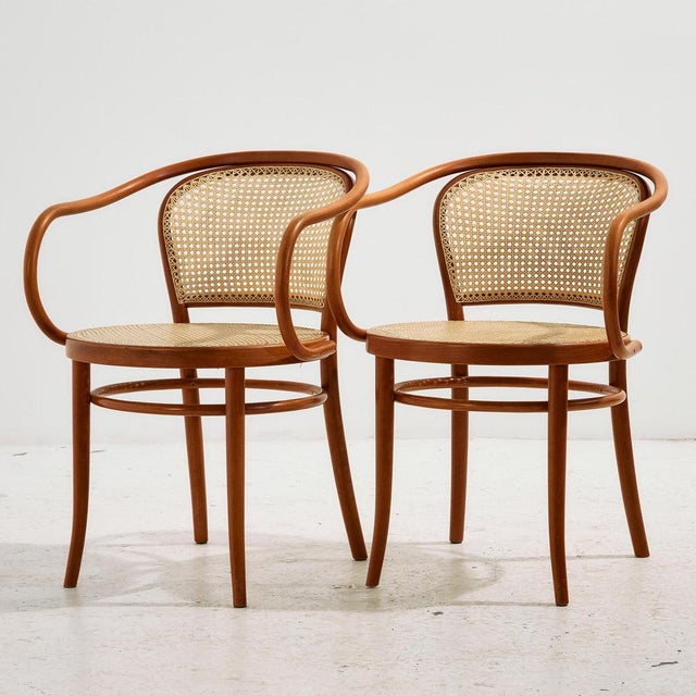 Thonet style beech armchair with rattan seat and backrest and exciting details. The surface of the chair has scratches,...