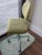 This great 1970s industrial midcentury modern chair on casters has an avocado seat and back with pale green enamel on the...