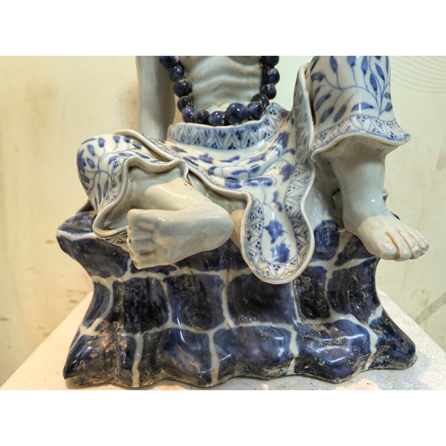 W-21.5cm,H-31cm This hand-carved blue and white porcelain statue depicts The Eighteen Arhats, a traditional Chinese...