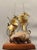 A striking handcrafted brass seahorse sculpture mounted on a natural quartz crystal and solid teak base, retaining its...