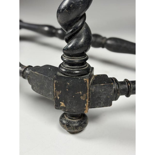 Black 19th-century console table. A simple mid-19th-century console table. Presumably from france. It was once painted...