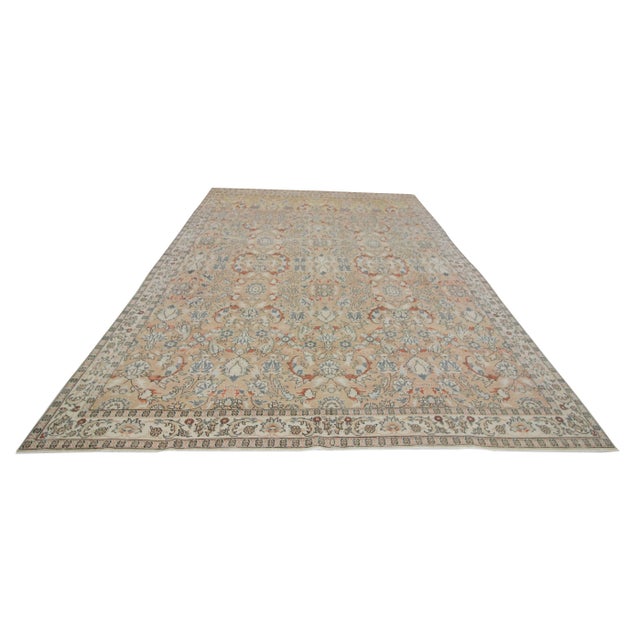 Vintage Oversized floral rug from Oushak region of Turkey. Approximately 55-65 years old. In very good condition