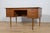 This desk made in Denmark in the 1960s. The desk is made of teak wood and is free-standing thanks to the finished back...
