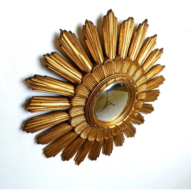 Resin sunburst mirror with convex mirror glass. The mirror is in a good condition. 1960s - made in Belgium. Dimensions:...