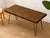 A distinctive vintage console table featuring a richly patterned mosaic tile top set within a slim wood frame and...