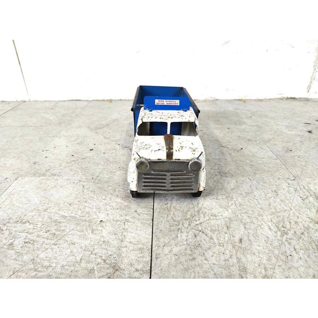 Vintage toy car from the english brand 'Tri-ang'. The charm is in the wear and tear of this item, it makes this little...