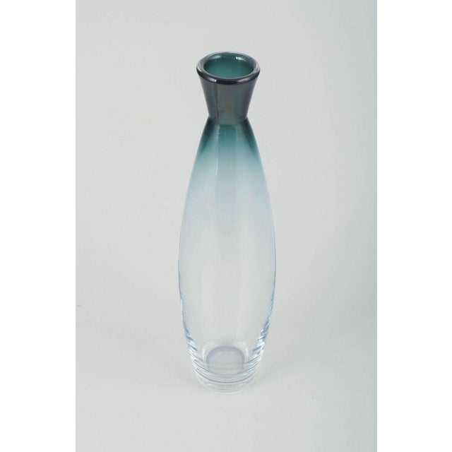 Bengt Orup for Johansfors. Slim glass vase, model "Tona". Sweden, 1950s Slim, mouth-blown vase in clear glass with a...