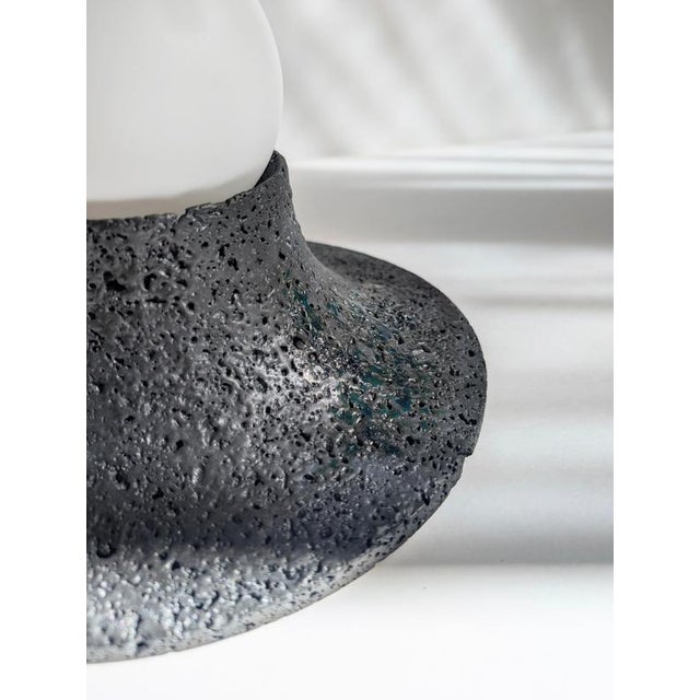 Basalte glazed lava stone wall lamp by clemence birot dimensions: ø 25 x h 15 cm materials: stone basalte is a stone lamp...