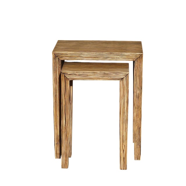 Designed by celebrated Filipino designer Clayton Tugonon, this striking pair of nesting tables showcases his signature use...