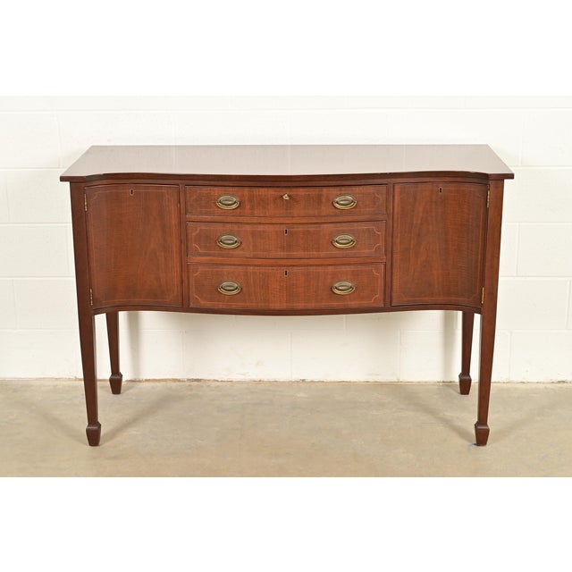 A gorgeous Federal or Hepplewhite style serpentine front sideboard, buffet server, or credenza By Kittinger USA, Circa...