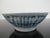 Small Chinese footed bowl. Rustic porcelain with blue glaze and geometric design underglaze. Measures 5" x 1 3/4" tall....