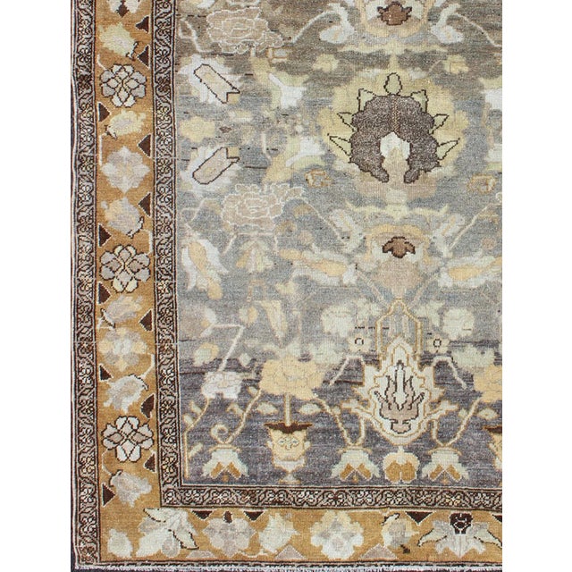 Measures: 4'5 x 5'11. Antique Persian Bakhtiari Rug with Soft Earth-Toned Floral and Botanical Motifs. Keivan Woven Arts /...