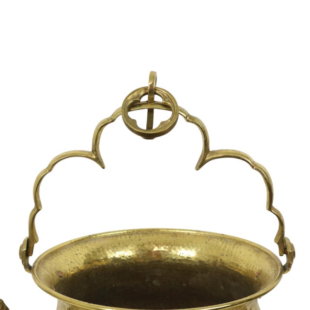 Beautiful and large antique copper or brass kettle, jardinière, or flowerpot with a heavy handle and hanger, featuring two...