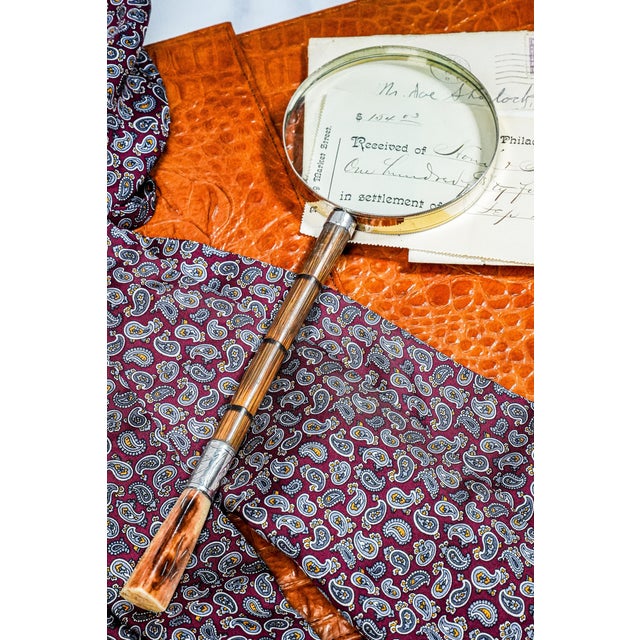 This stunning magnifying glass is a masterful blend of history, craftsmanship, and function. Repurposed from an authentic...