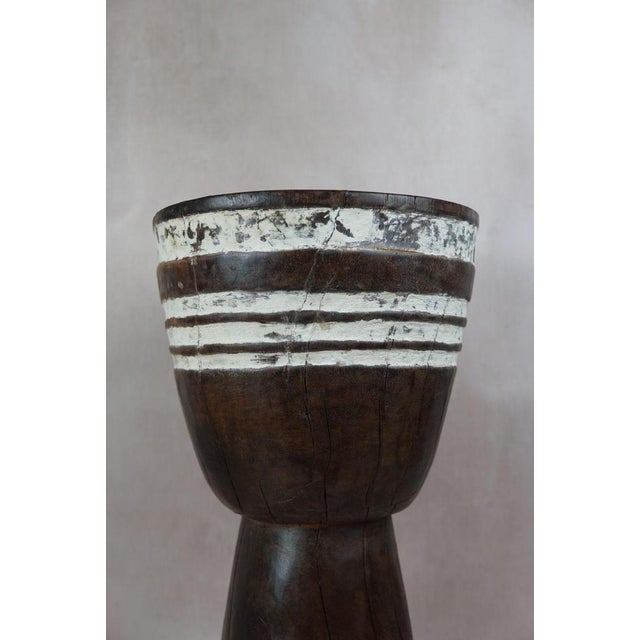 Introduce a touch of African elegance into your living space with this remarkable solid wood carved side tablestool from...