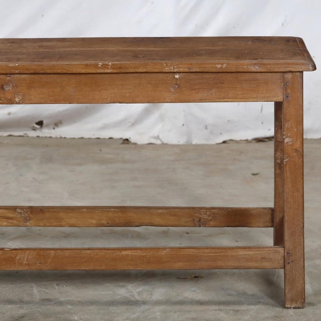Vintage Indian Teakwood Bench, mid-century from a school or public space. It is functional and versatile with a beautiful...