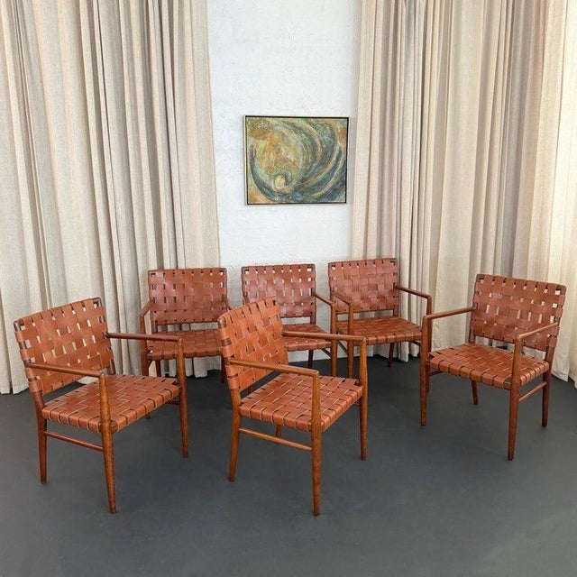 This set of six Mid-Century Modern dining armchairs, are in the style of designer T.H. Robsjohn-Gibbings. These armchairs...