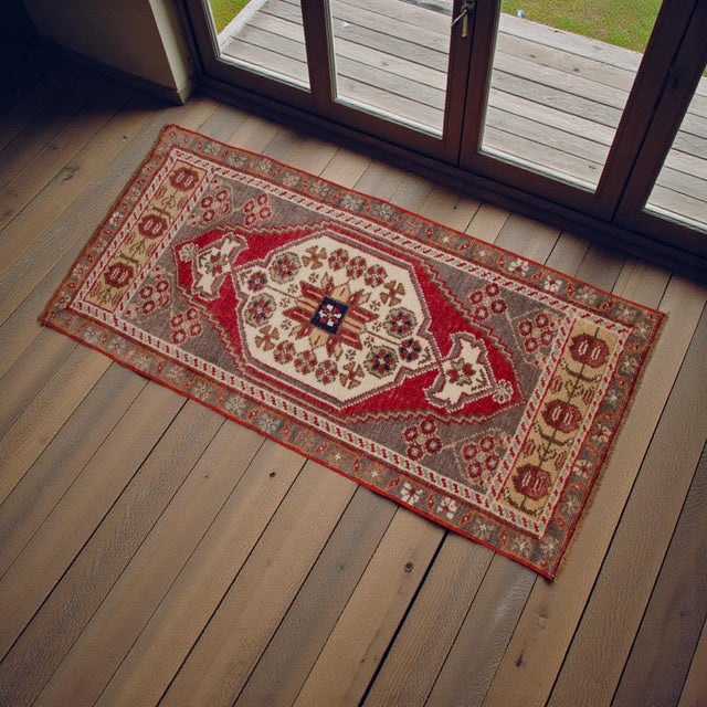 Vintage Turkish hand-knotted small rug from Konya, Central Anatolia, 1970, featuring warm taupe-brown tones and authentic...