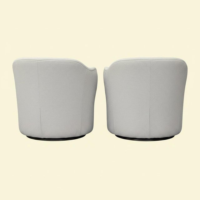 A pair of club chairs designed by Edward Wormley for Dunbar, balancing comfort and sophistication. Crafted with Dunbar's...