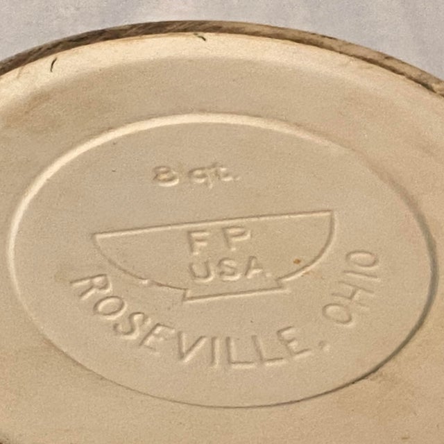 Traditional farmhouse-style ribbed cream colored Friendship Pottery Made in Roseville, Ohio mixing bowl.