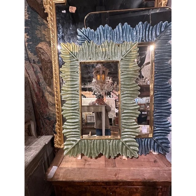 Modern Murano glass and brass palm leaf mirror in pale green. Perfect for today's transitional designs!