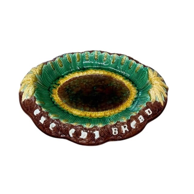 Add timeless charm to your home with this striking vintage majolica-style ceramic bread platter. Crafted with rich,...