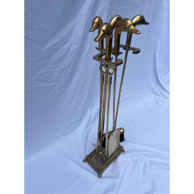 Vintage brass mallard set of fireplace tools on stand. Set includes brush, poker, tongs and shovel. Tools measurements...