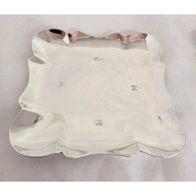 A fine pair of vintage sterling silver bon bon or trinket dishes dating to 1972, displaying an elegant and understated...