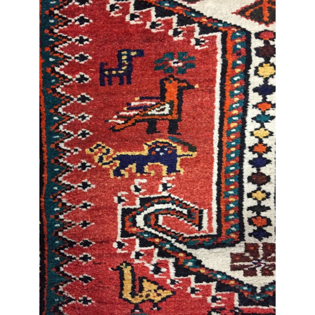 A charming design featuring hand-woven images of various animals intricately incorporated into the pattern. Colors include...