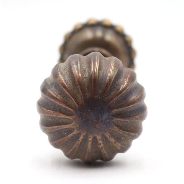 Vintage passage fluted bronze door knobs with a patina finish. Good condition with surface wear from prior use. Priced as...